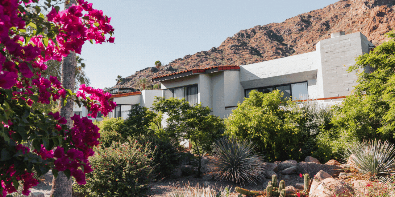 Mountainside casita at Sanctuary Camelback Mountain; a couple in robes enjoying coffee on their hotel room bed