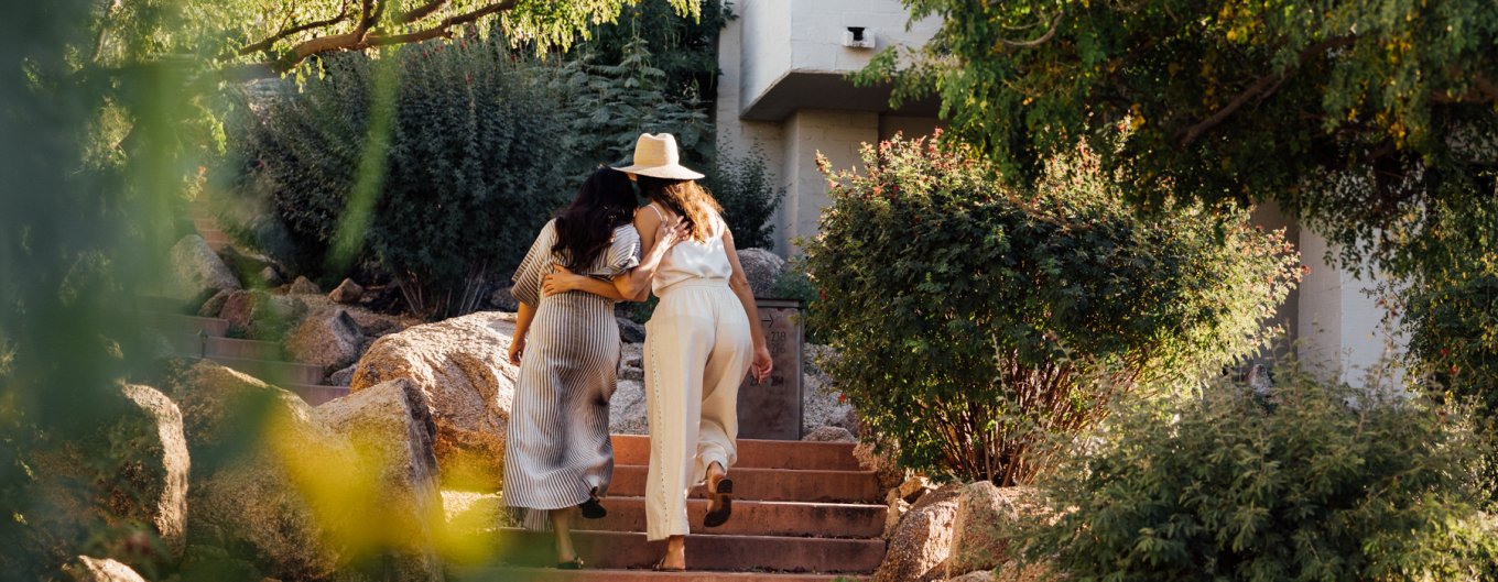 Girlfriends enjoying a moment as they walk through Mountain Casitas and Suites.