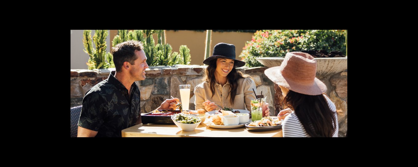 Friends enjoying brunch on elements' Praying Monk Patio.