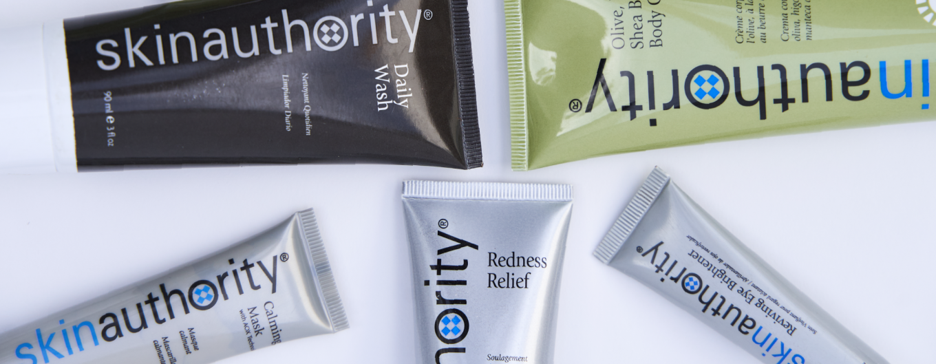 A colorful assortment of products from Skin Authority laid against a white background