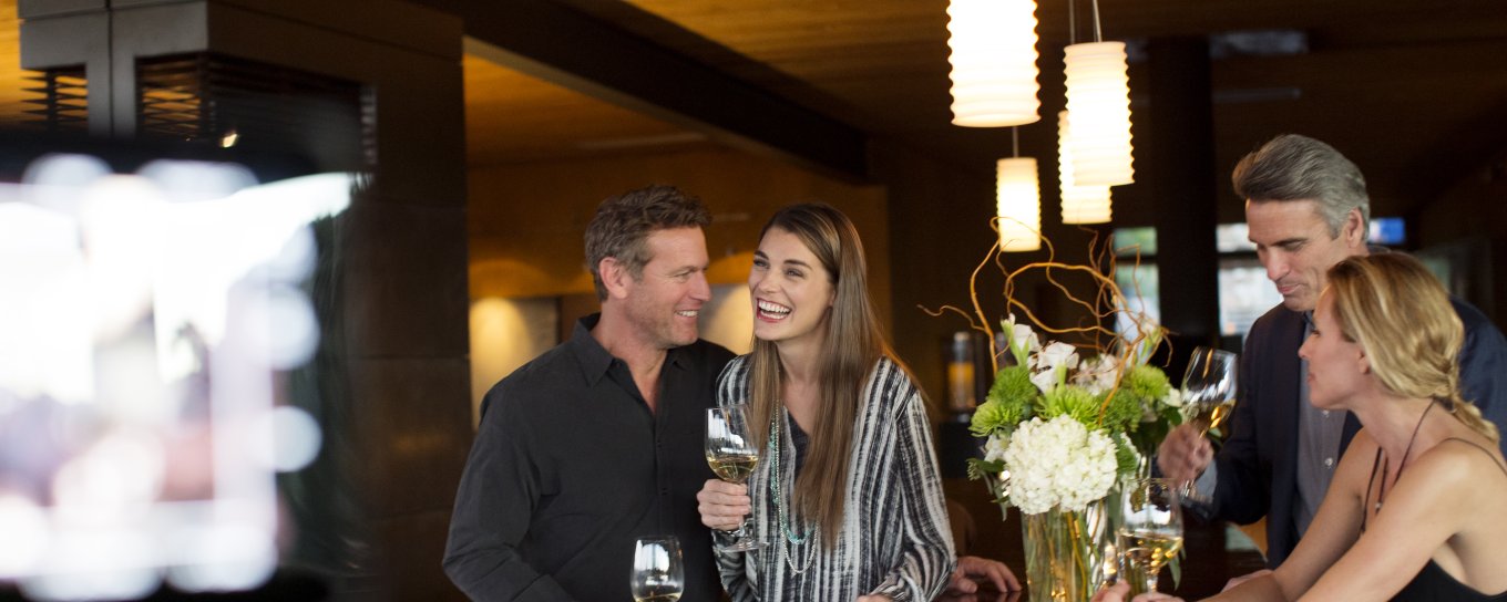 Couples sipping on wine in restaurant