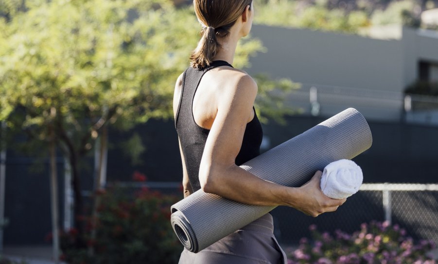 Women with yoga mat