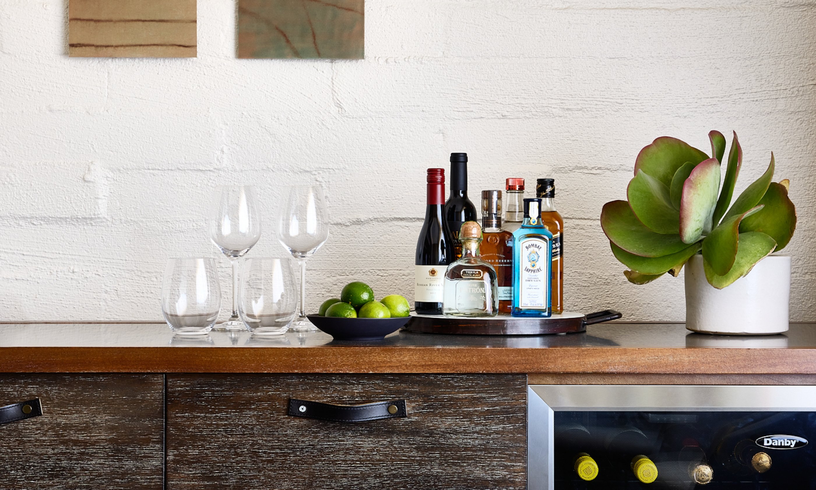 Mini fridge and bar with select wines and spirits.