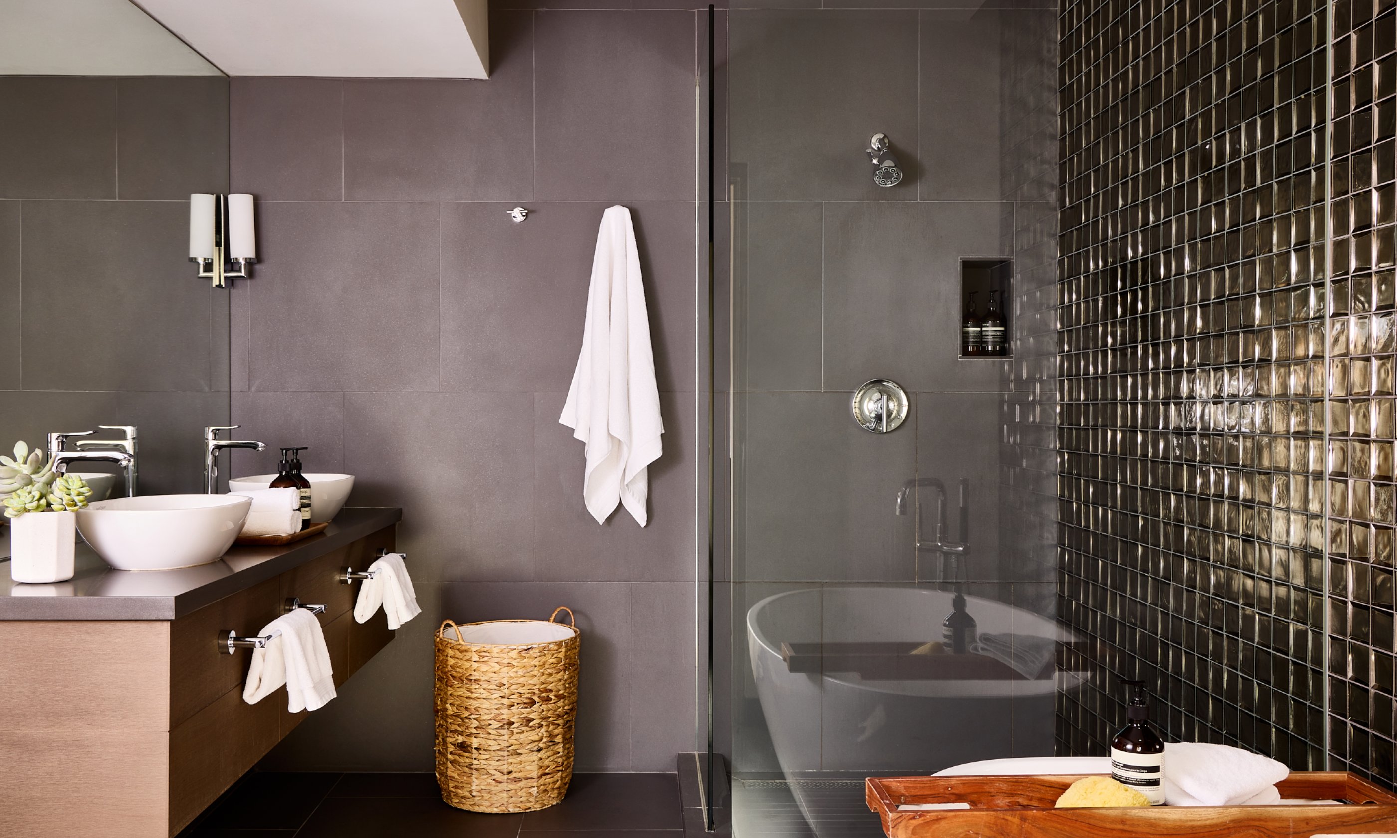 Bathroom with soaking tub, walk-in shower, two sinks and vanity.