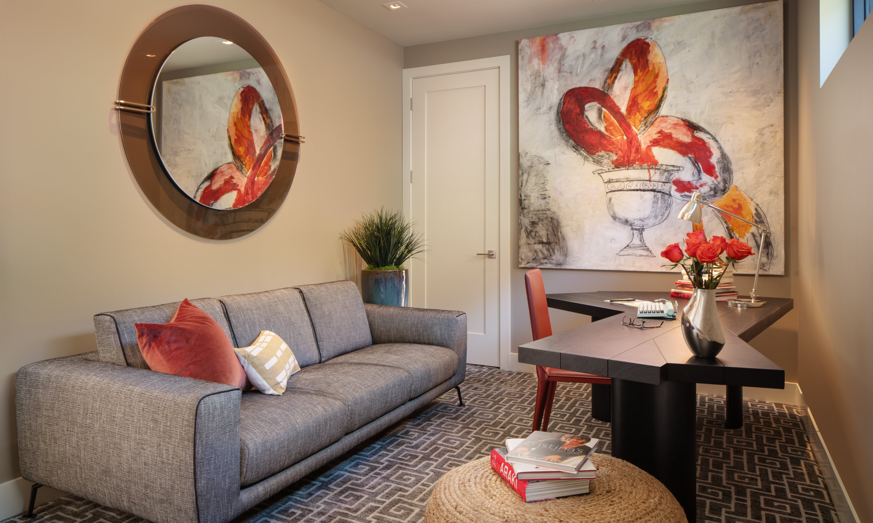 Sitting room with couch, writing table and chair.