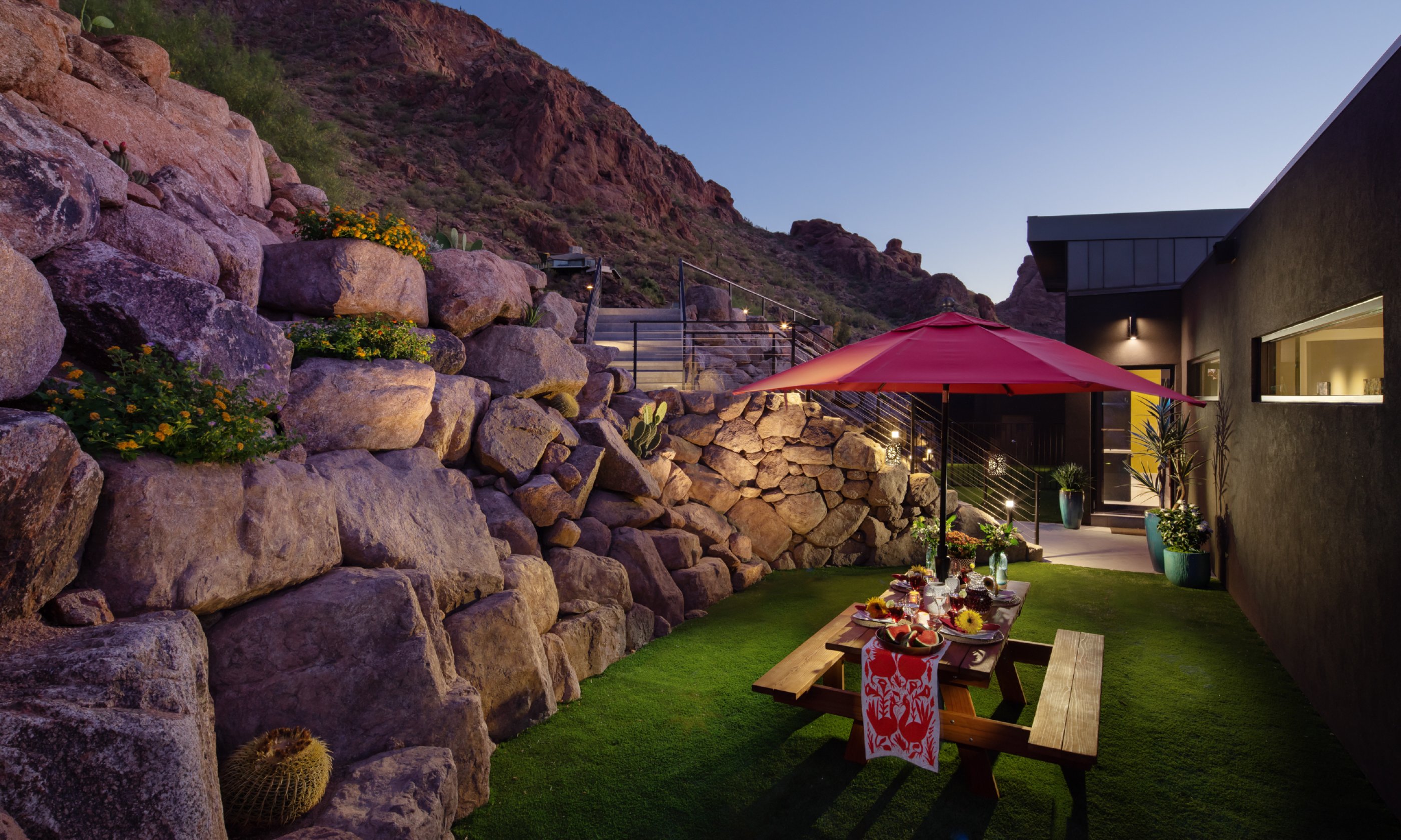 Courtyard with wooden picnic bench and view of Camelback Mountain.