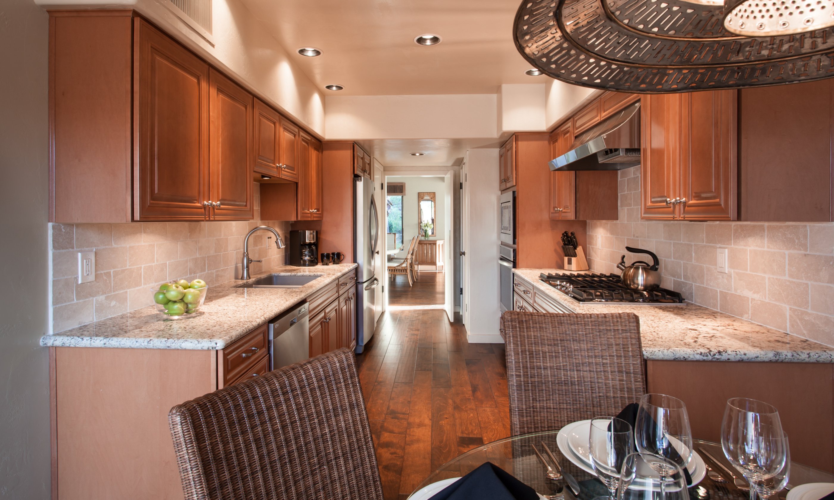 Villa Norte kitchen with stove, coffee pot and dining table.