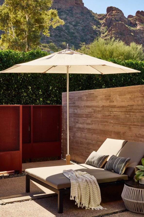 Lounge seat and umbrella on Terrace Casita patio.