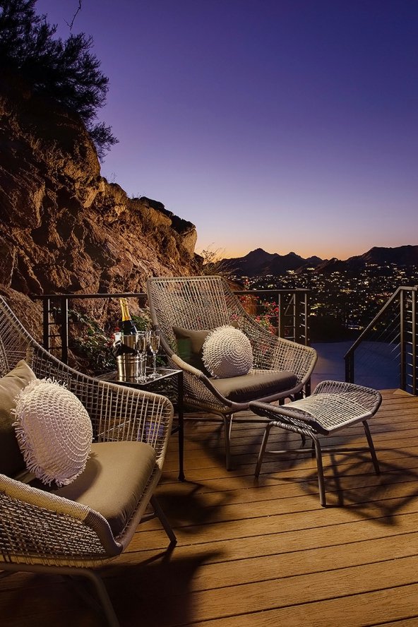 Villa Ventana guest house patio with seating area at dusk.