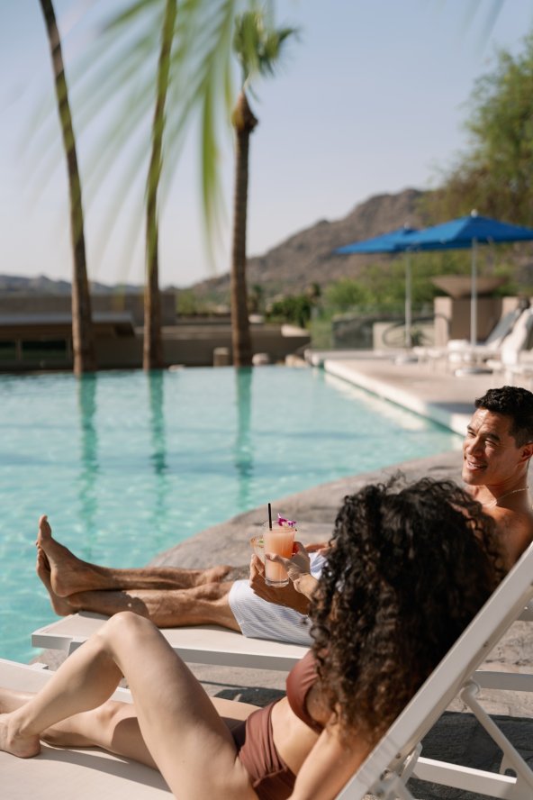 Couple lounging at the Infinity Pool