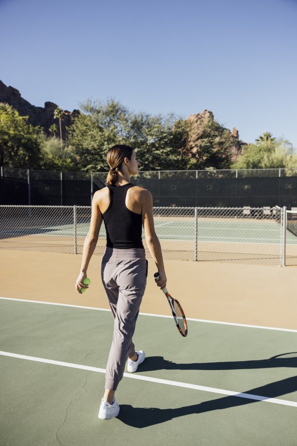 Women on tennis court