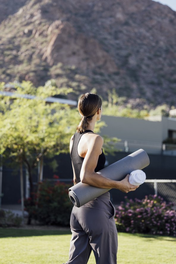 Woman with yoga mat