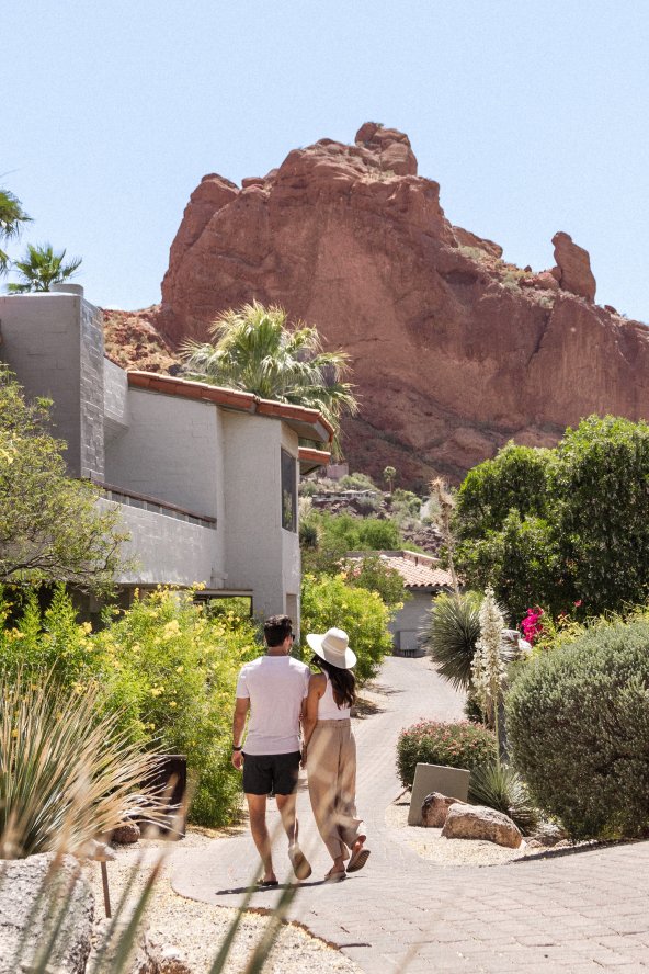 Couple walking on resort grounds