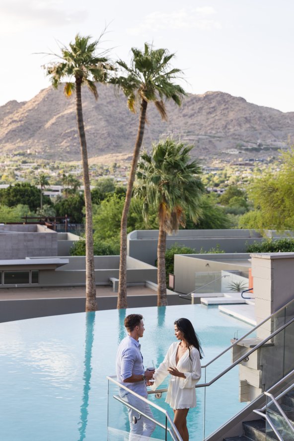 Couple overlooking pool